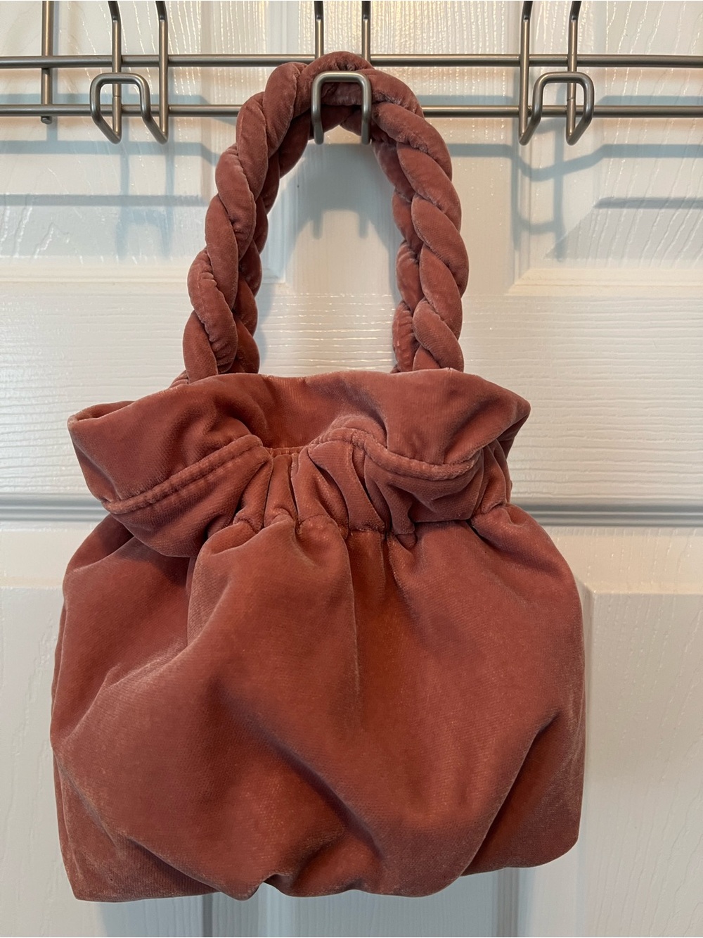 STAUD Velvet Braided-Handle handbag in light pink with snap to close.